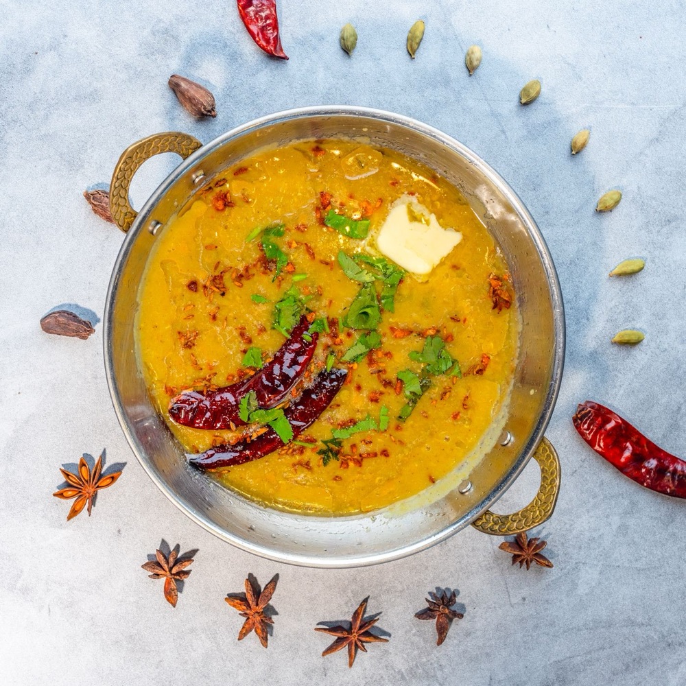Indian dal tadka in a brass bowl