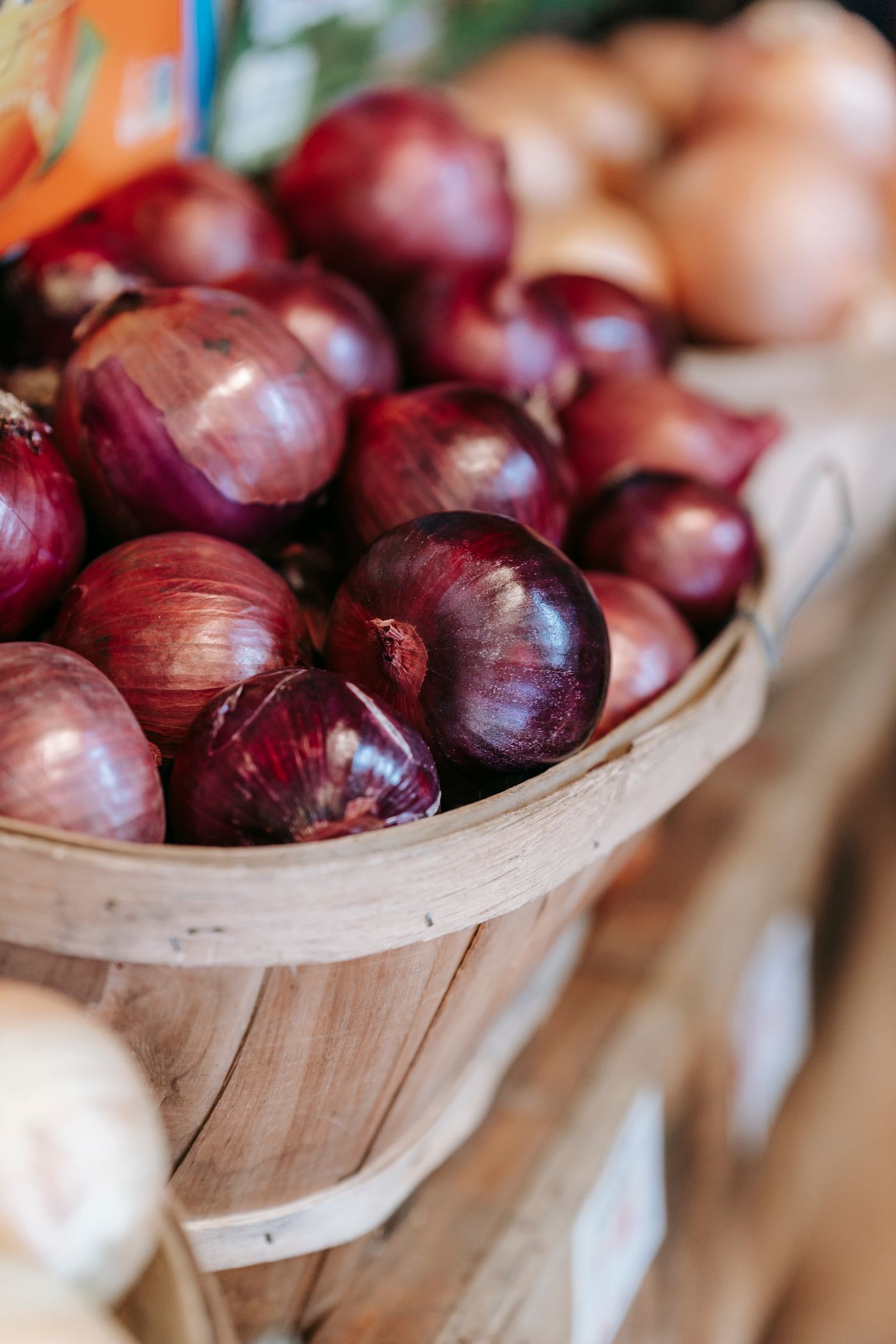 Red onions in a wooden basket